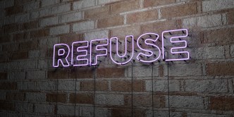 REFUSE - Glowing Neon Sign on stonework wall
